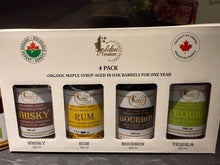 Four-pack of organic maple syrup cans labeled Whisky, Rum, Bourbon, and Tequila on a white background.