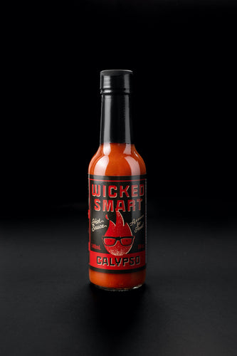 Hot sauce bottle labeled 'Wicked Smart Calypso' on a black background