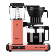 Moccamaster coffee maker with a pink base on a white background