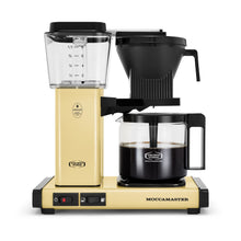 Moccamaster coffee maker with beige base and black top on a white background