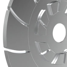Close-up of a metallic coffee grinder disc wheel rim on a white background
