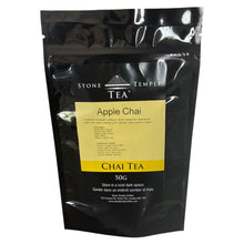 Black packaging of Stone Temple Tea Apple Chai with a yellow label on a white background