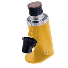 Yellow single dose coffee grinder with wooden top on a white background