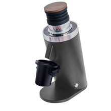 Black coffee grinder with wooden top on a white background