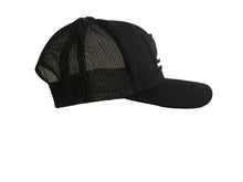 A black Stone Temple Coffees ball cap with a white stitched logo patch on the front. Side view.