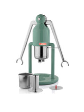 Green manual juicer with metal components on a white background