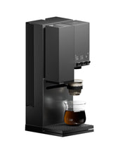 Black coffee machine with two glass cups on a white background