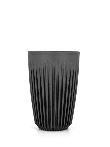 Black textured tumbler on a white background