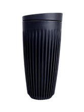 Black ribbed tumbler on a white background
