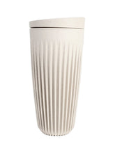 Beige textured tumbler on a white background