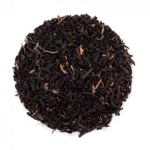 A close-up image of orange pekoe dried black tea leaves and buds.