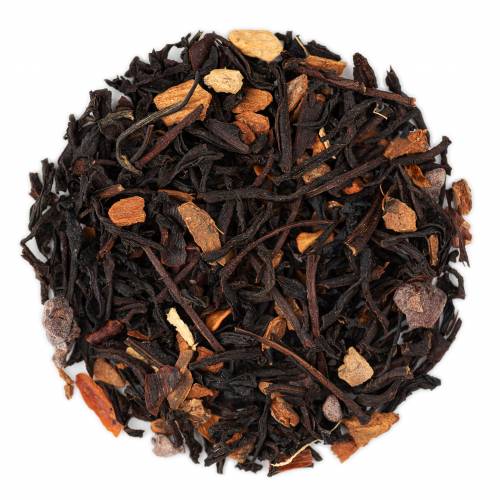 A close-up of Spicy Cacao loose leaf tea with visible pieces of black tea, cinnamon, ginger root, and chili flakes.