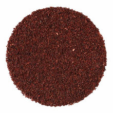 A circular pile of dark reddish-brown ground sumac berries on a solid white background.