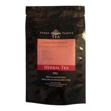 A black Stone Temple Tea pouch with roasted organic chicory root inside. On a white background.