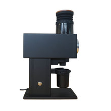 Black coffee grinder on a white background
