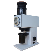 Coffee grinder with a white base and black top on a white background