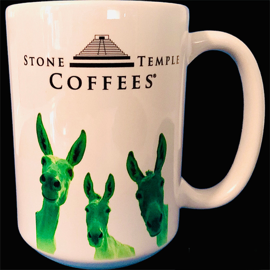 A white stoneware coffee mug with the Stone Temple Coffees logo and a green illustration of donkeys on it.