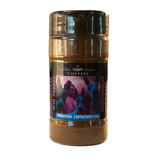 A jar of Stone Temple Coffees Tandoori Espresso Coffee Rub BBQ Seasoning with a label showing the product name and a silhouette of a skyline.