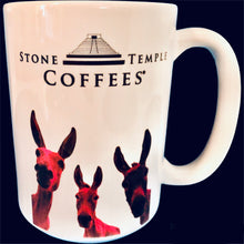 A white stoneware coffee mug with the Stone Temple Coffees logo and a pink illustration of a donkeys on it.